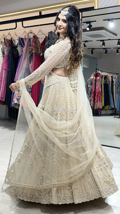 Tube & pearl work on net ivory cream lehenga along with four side border dupatta