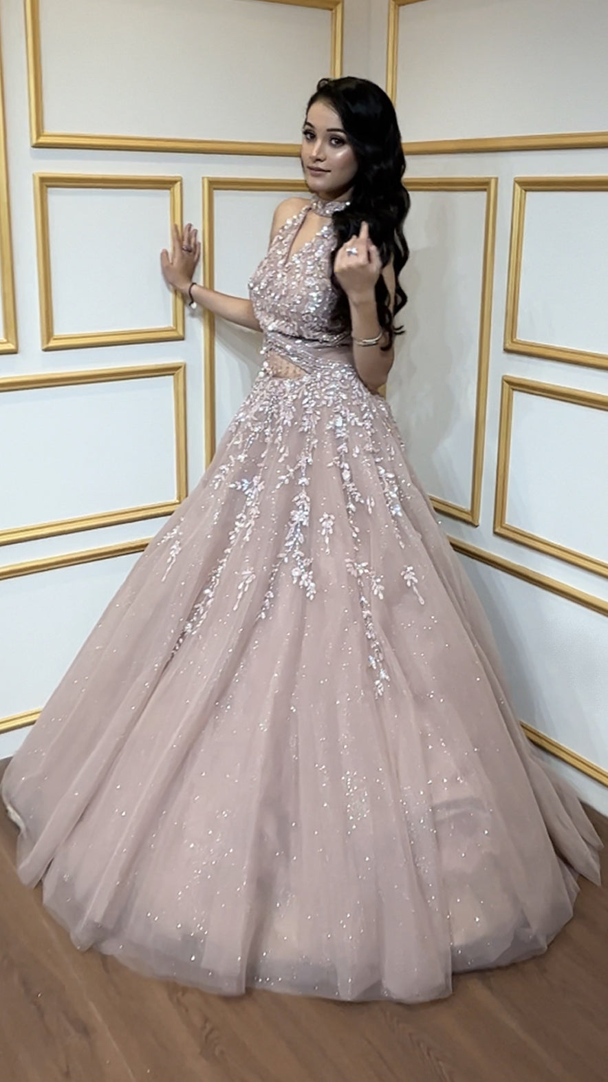 Rose gold engagement gown with cut dana & crystal in net along with peephole detailing