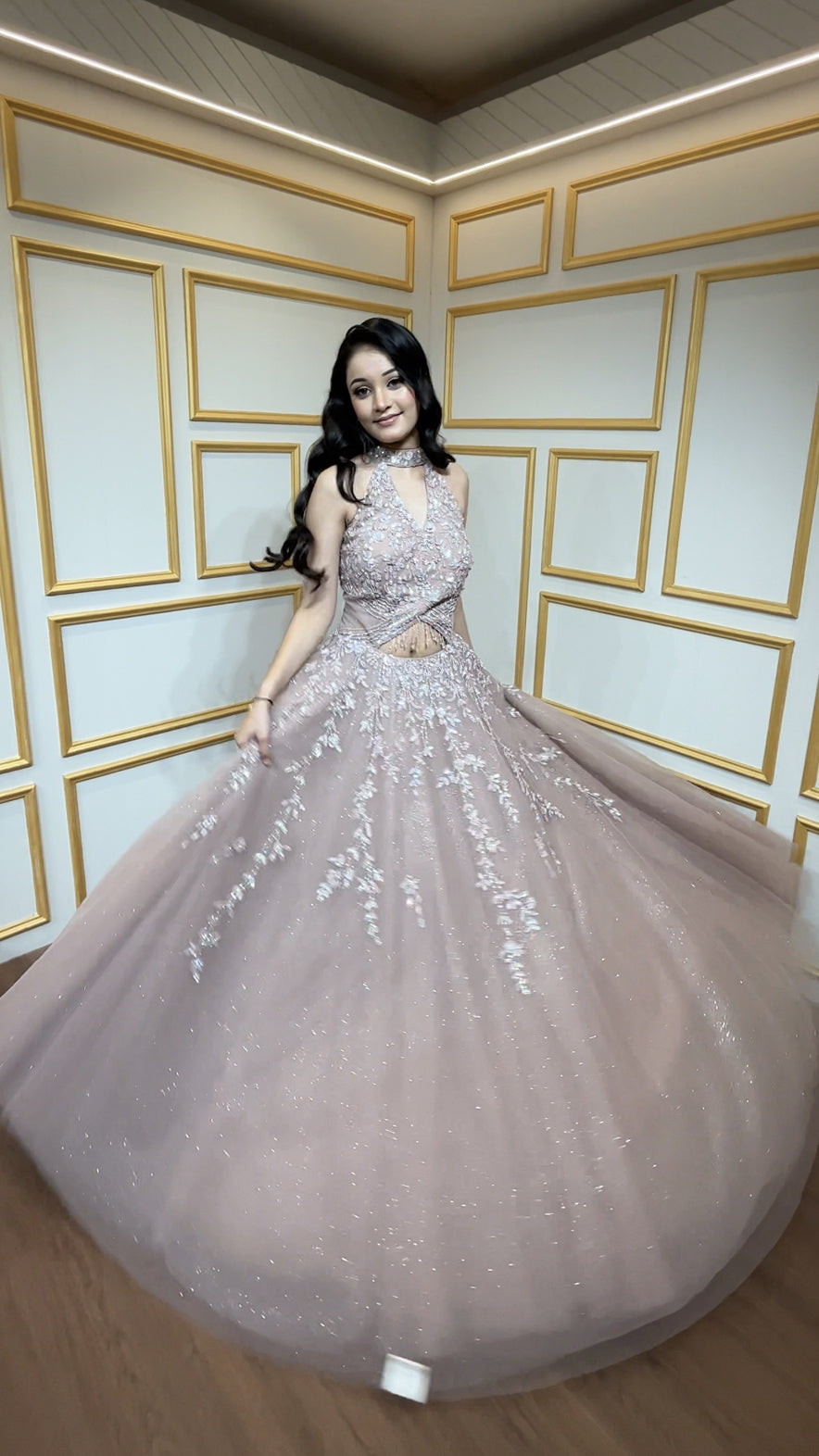 Rose gold engagement gown with cut dana & crystal in net along with peephole detailing