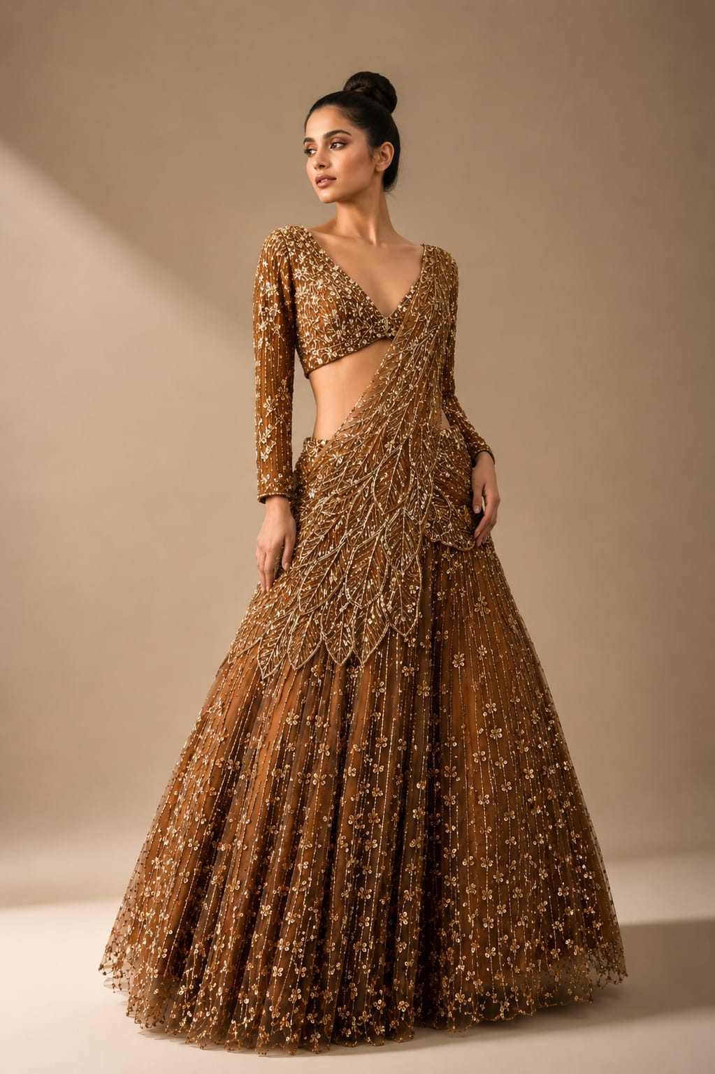 Net drape lehenga in deep gold with heavy sequins & zarkan work and designer blouse