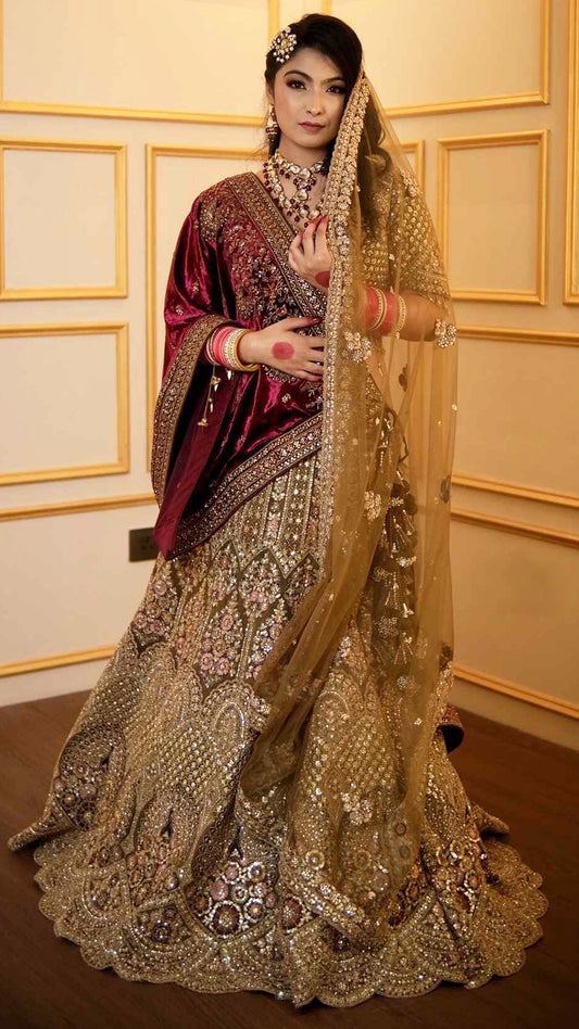 Zari & multicolor thread work on net bridal lehenga in tan with heavy dupattaZari & multicolor thread work on net bridal lehenga in tan with heavy dupatta