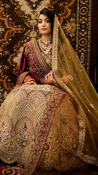Zari & multicolor thread work on net bridal lehenga in tan with heavy dupattaZari & multicolor thread work on net bridal lehenga in tan with heavy dupatta