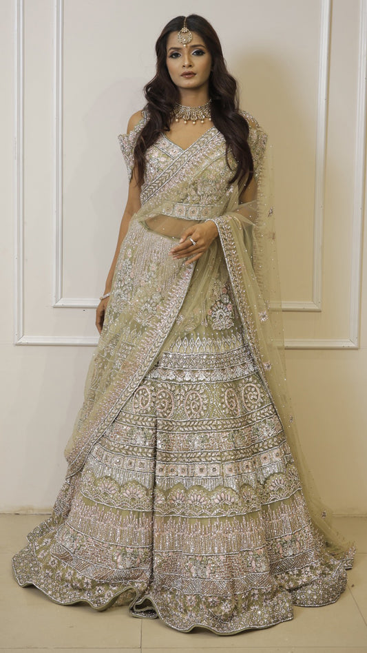 Pista green bridal lehenga in net with thread & crystal
