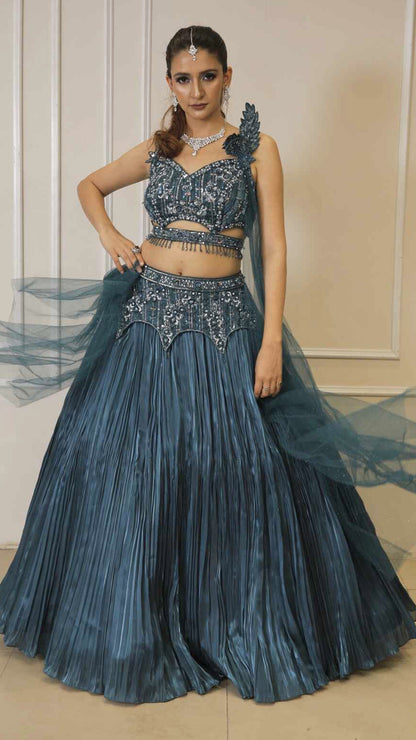 Dark teal lehenga with cutwork blouse on crystal & sequins work with falling sleeves