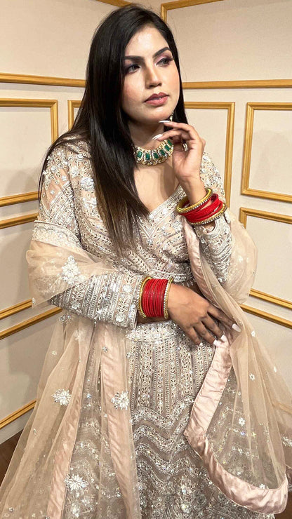 Crystal & thread work on creamy beige net lehenga with embroidered dupatta
