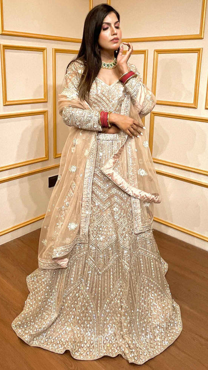 Crystal & thread work on creamy beige net lehenga with embroidered dupatta
