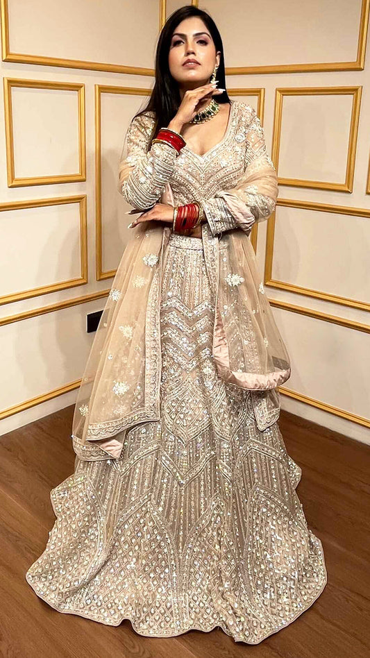 Crystal & thread work on creamy beige net lehenga with embroidered dupatta