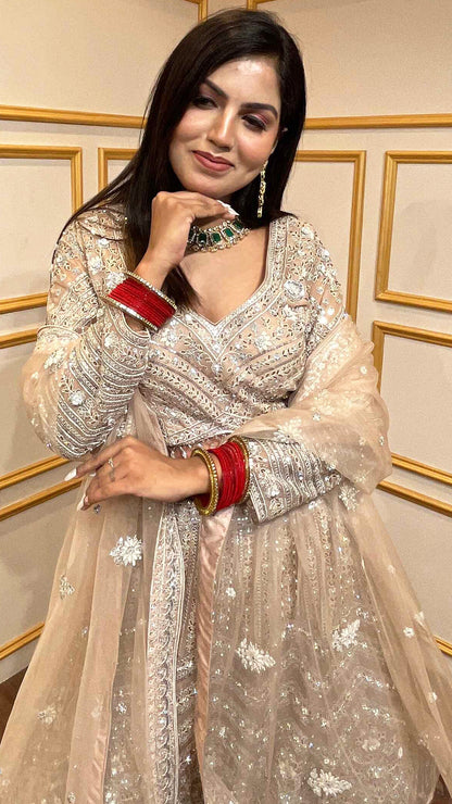 Crystal & thread work on creamy beige net lehenga with embroidered dupatta