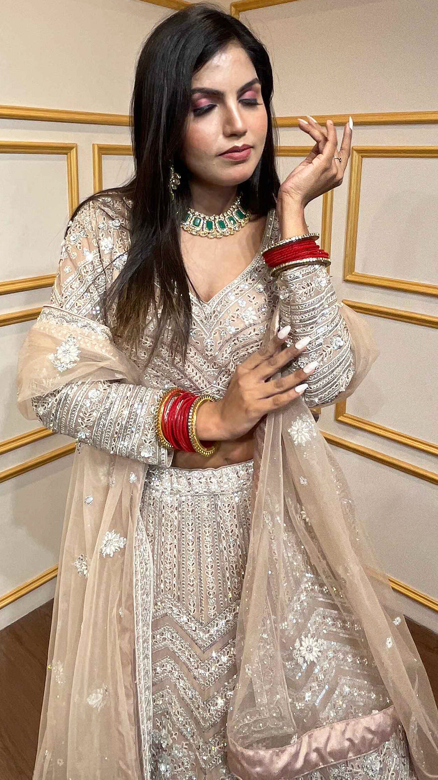 Crystal & thread work on creamy beige net lehenga with embroidered dupatta
