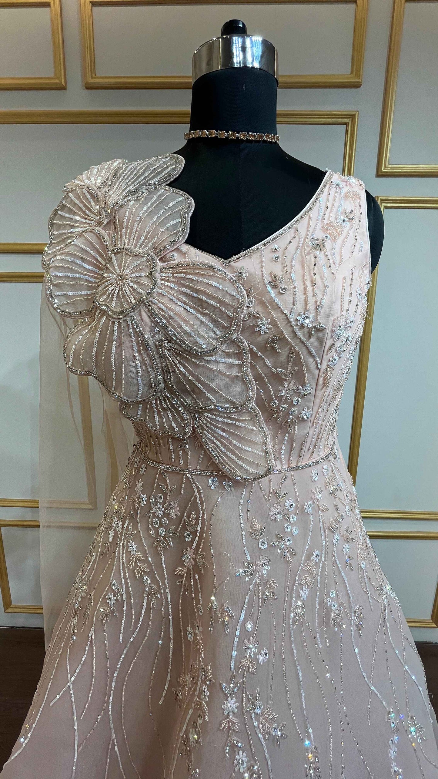 Crystal & pearl work on mesh gown in powder peach color