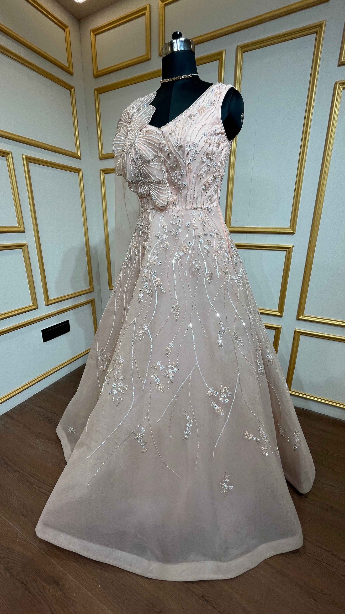 Crystal & pearl work on mesh gown in powder peach color