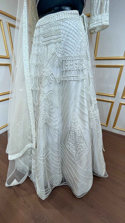 Ivory net lehenga with cut dana & sequins