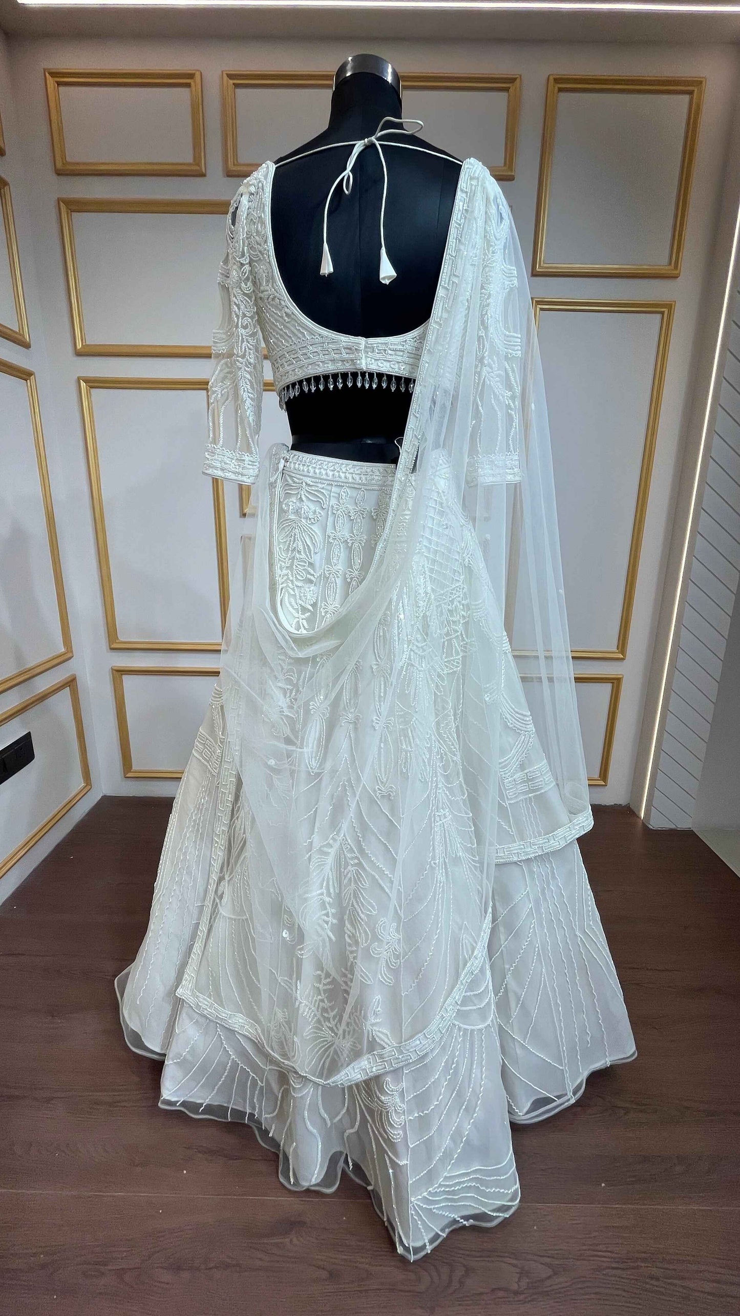 Ivory net lehenga with cut dana & sequins