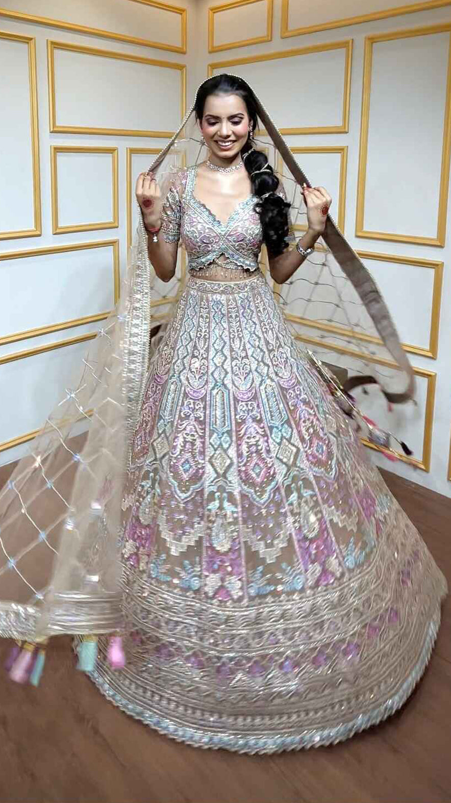 Multicolor thread & zari work on nude brown net lehenga with heavy dupatta