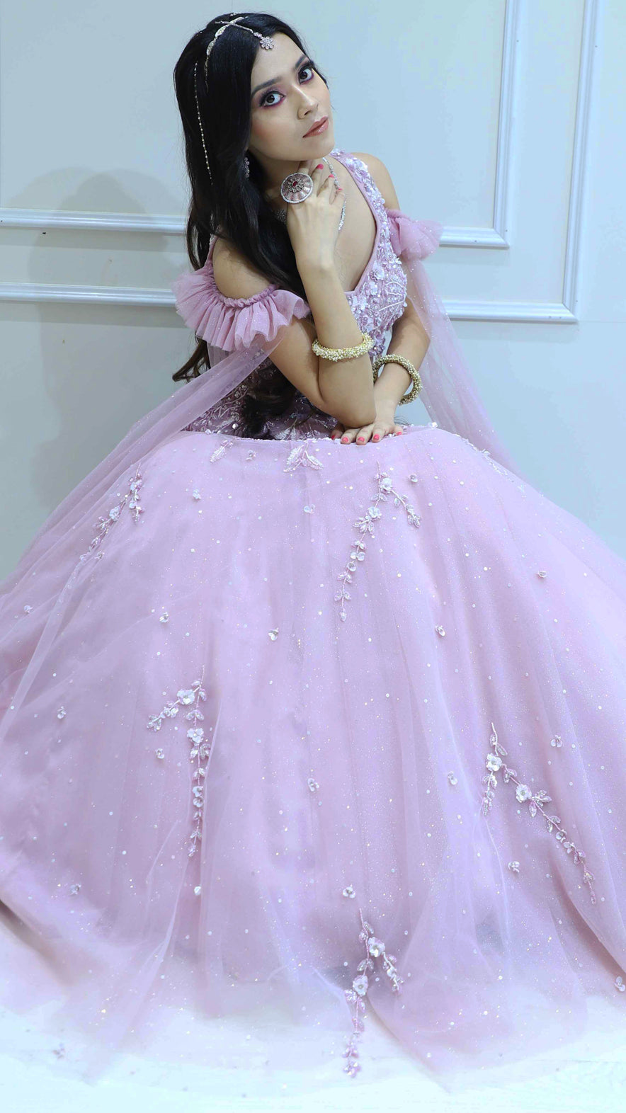 Net lehenga in blush pink with sequins & stone