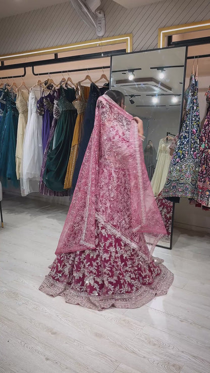 Magenta lehenga with zari & mirror on net with heavy dupatta