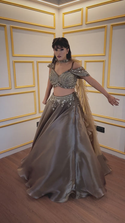 Organza lehenga choli in mehendi green with sequins & cut dana