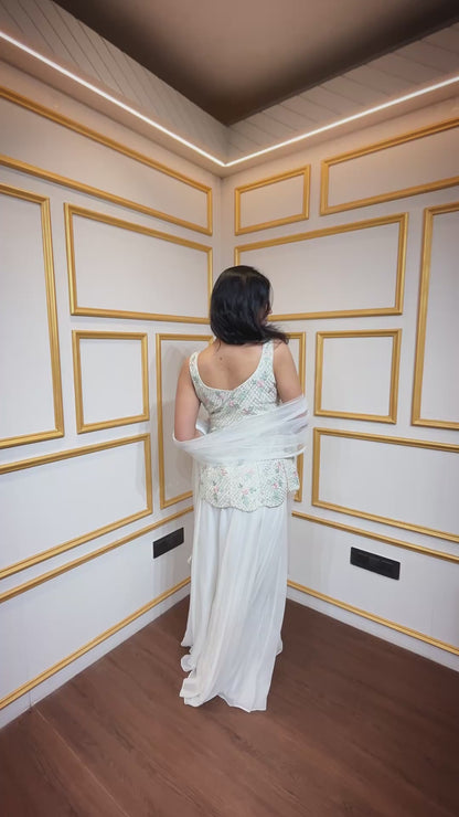 Off white peplum top with sequins & swarovski along with georgette plazo