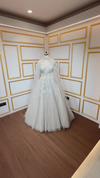 Net engagement gown with zarkan & cut dana work and detachable neck collar in nude beige
