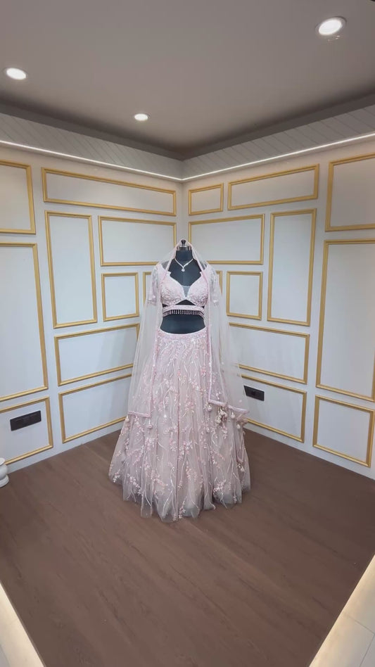 Pearl & cut dana work on powder peach lehenga with cutwork blouse and heavy dupatta