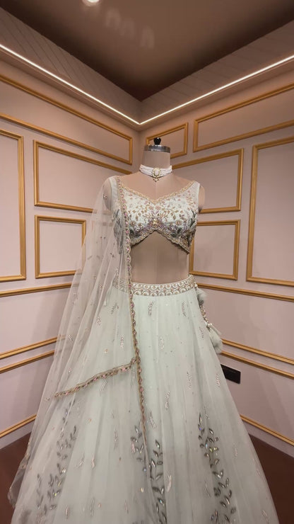 Powder mint engagement lehenga in net with resham & zarkan