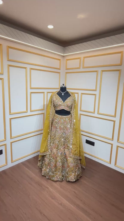 Thread & pearl work on dusty mustard lehenga in organza with heavy dupatta