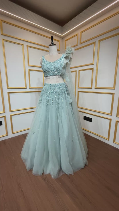 Powder mint green engagement lehenga with sequins & zarkan work on net