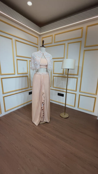 Powder peach dhoti style in crape with net poncho with pearl & tube work