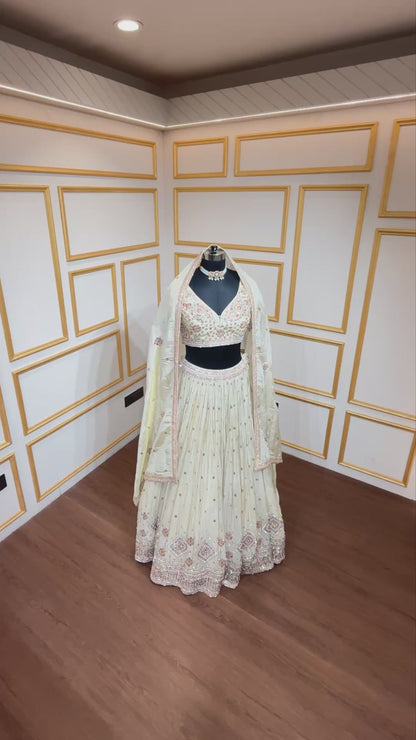 Golden beige lehenga with pearl & zari work on chinon