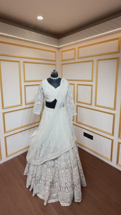 Resham & zarkan work on white smoke lehenga with heavy dupatta