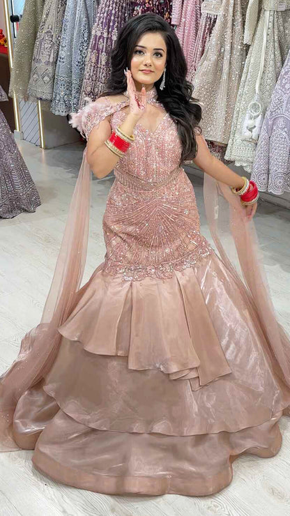 Ruffle mermaid gown in peach with pearl & sequins handwork and cape with falling sleeves
