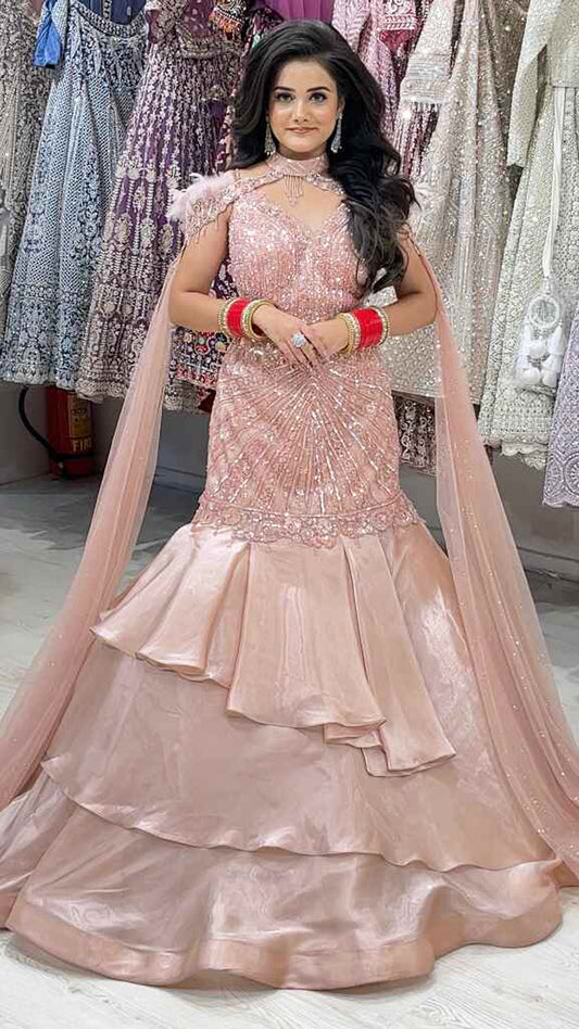 Ruffle mermaid gown in peach with pearl & sequins handwork and cape with falling sleeves