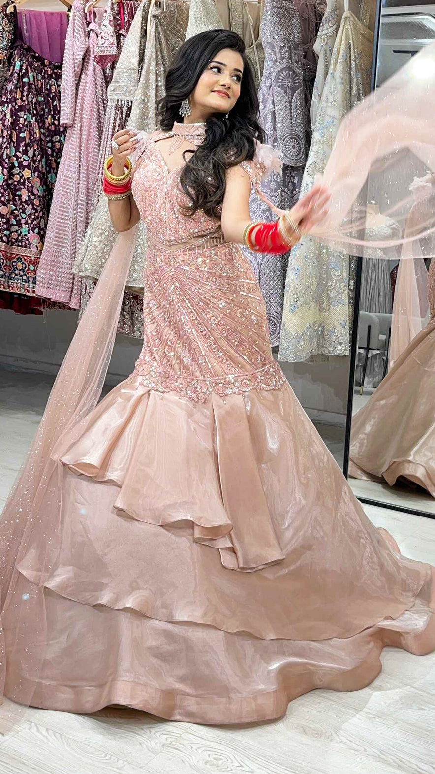 Ruffle mermaid gown in peach with pearl & sequins handwork and cape with falling sleeves