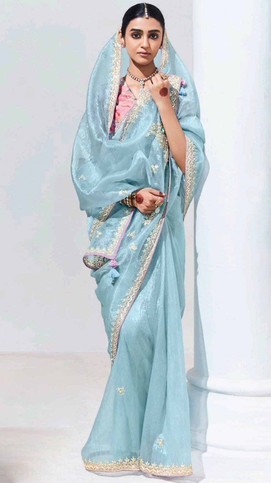 Baby blue organza saree with contrasting printed light pink unstitched blouse