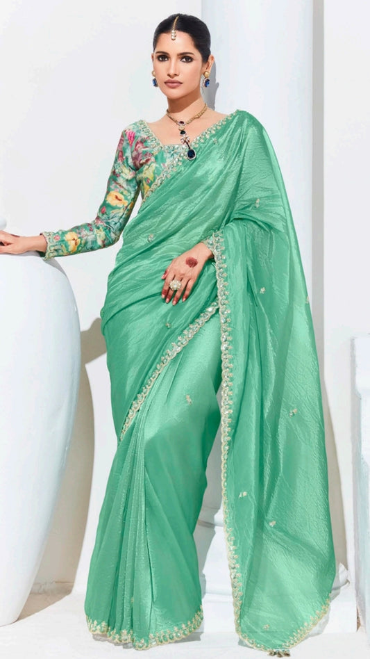 Mint green saree with printed blouse and gota patti work in glaze organza