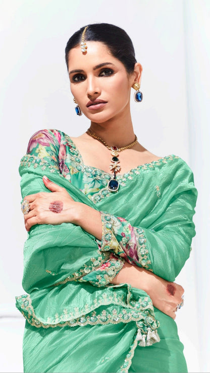 Mint green saree with printed blouse and gota patti work in glaze organza