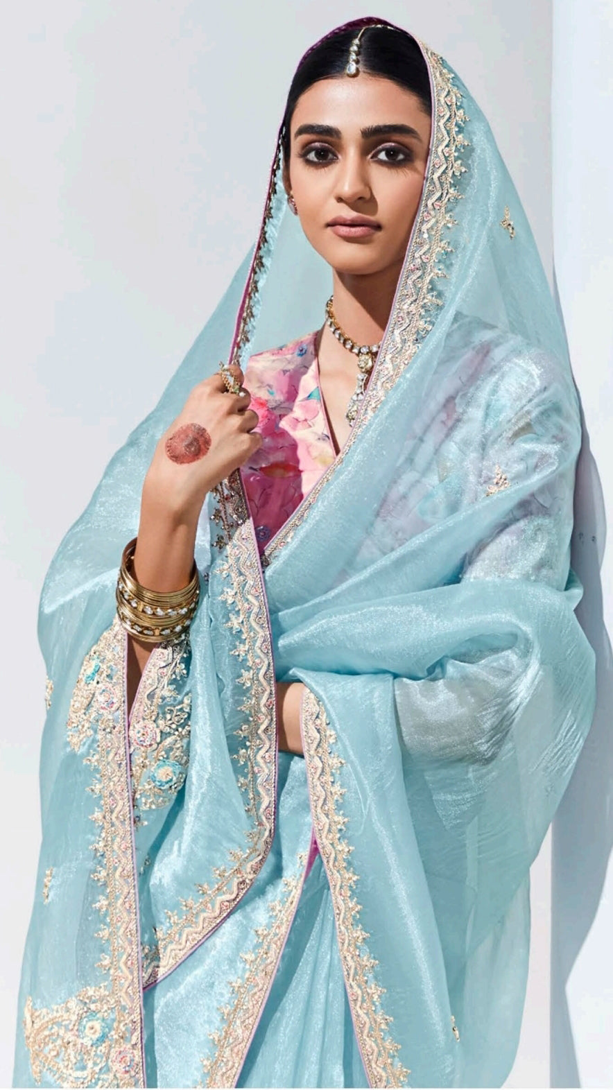 Baby blue organza saree with contrasting printed light pink unstitched blouse