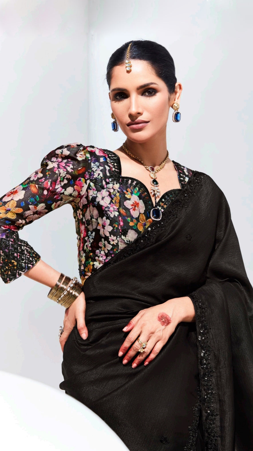 Organza saree in black with sequins border and multicolour unstitched blouse