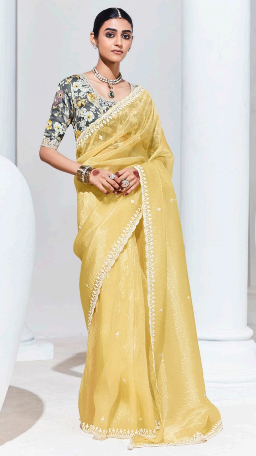 Organza saree with thread work border in pastel yellow and grey printed blouse