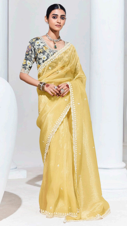 Organza saree with thread work border in pastel yellow and grey printed blouse