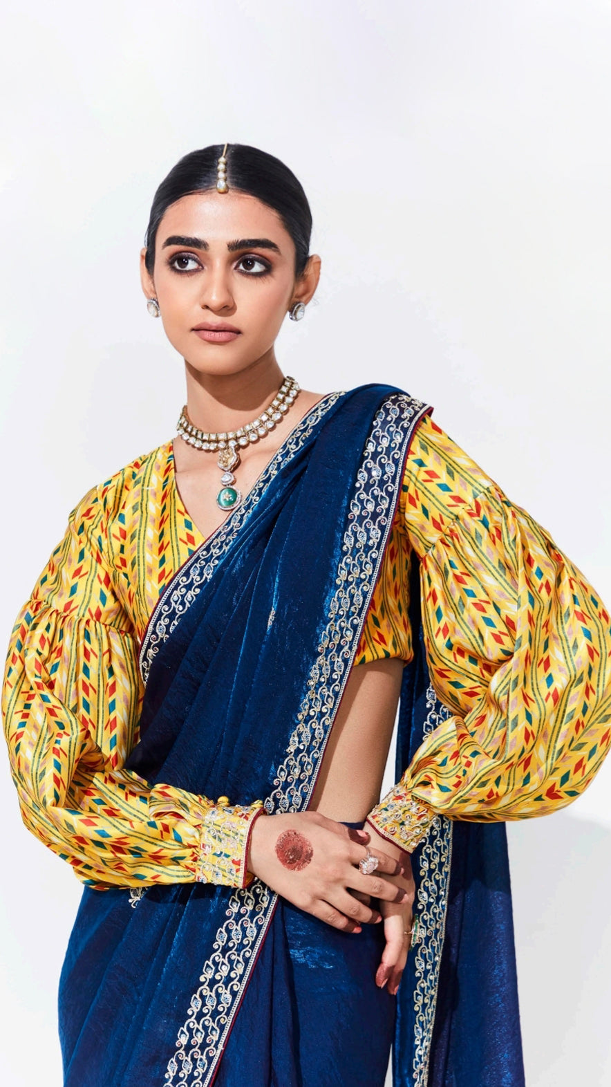 Sapphire blue saree with contrasting printed yellow unstitched blouse in glaze organza